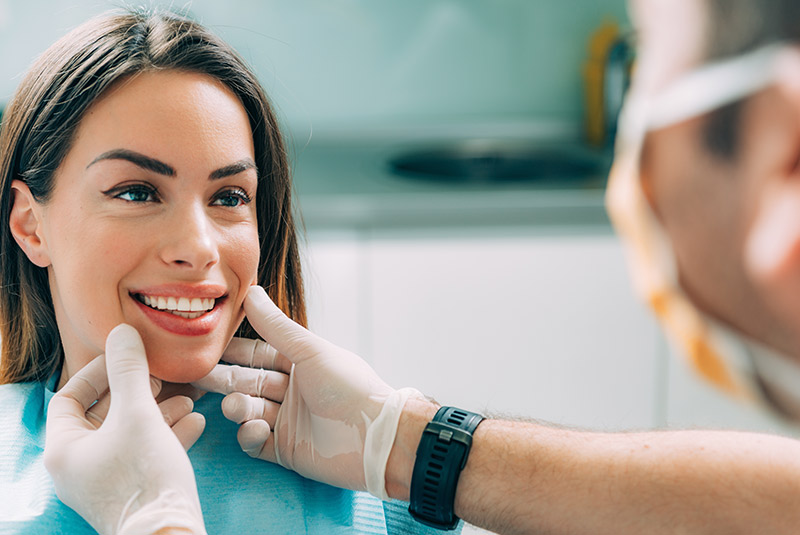 Very nice lady smiling getting help from dentist