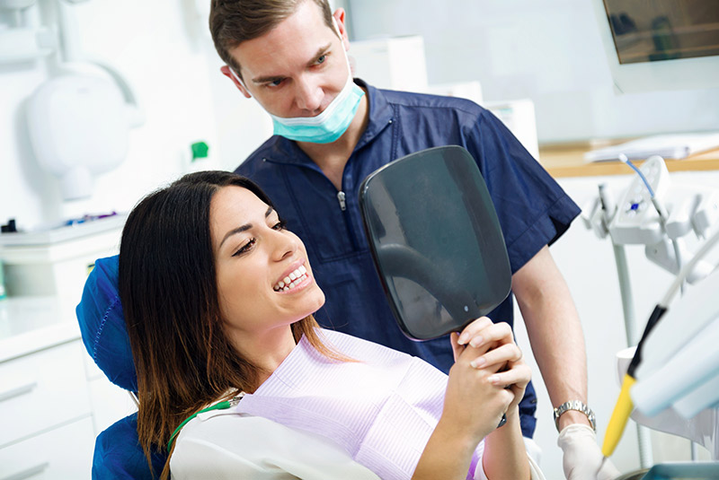 Very nice lady and dental assistant looking at the results