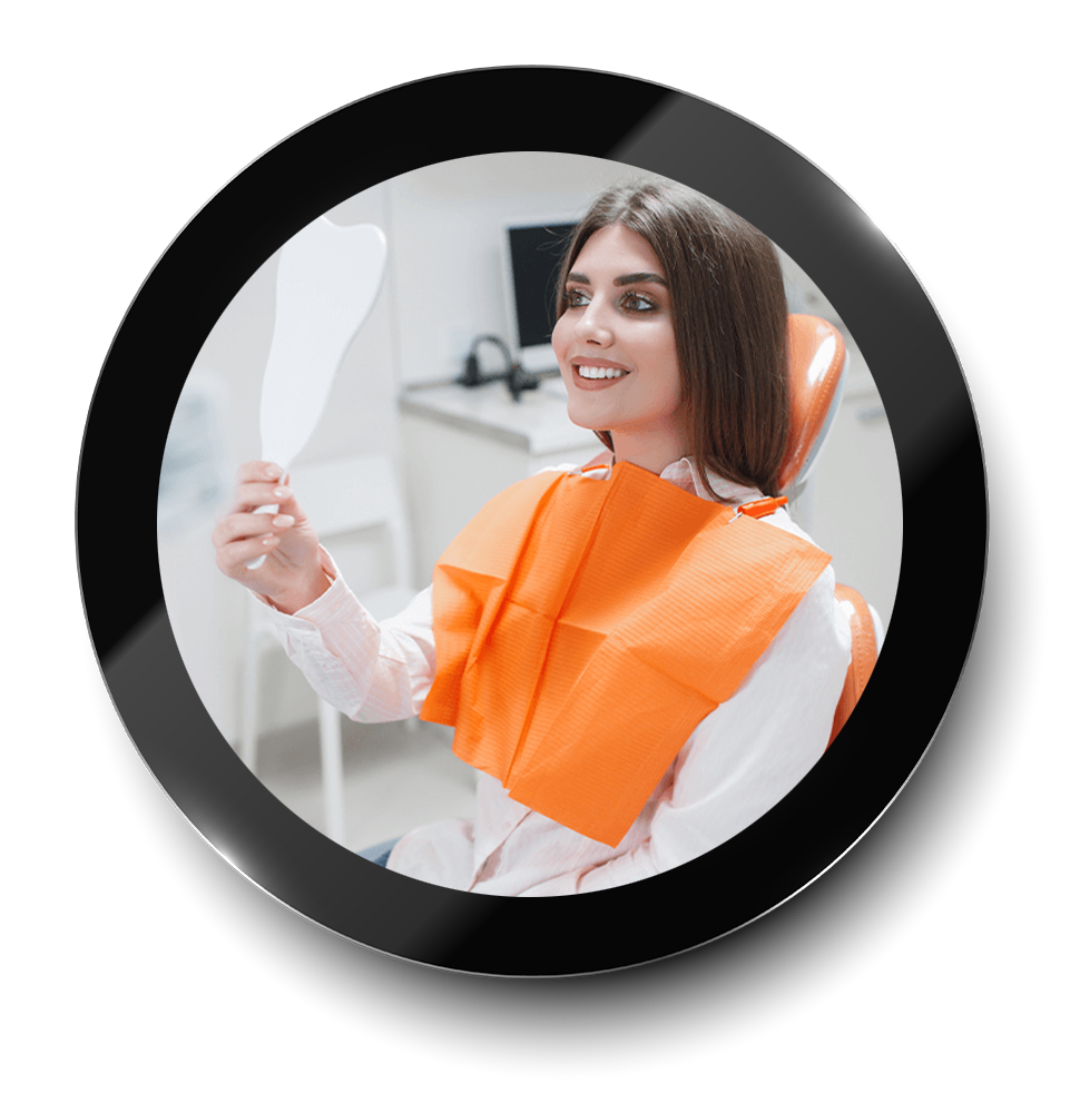 girl smiling at dentist with mirror