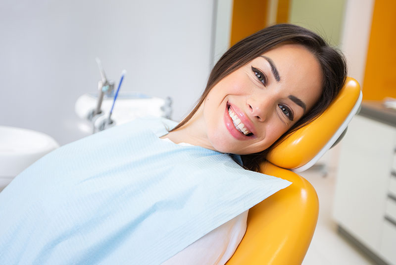 dental patient smiling in exam chair