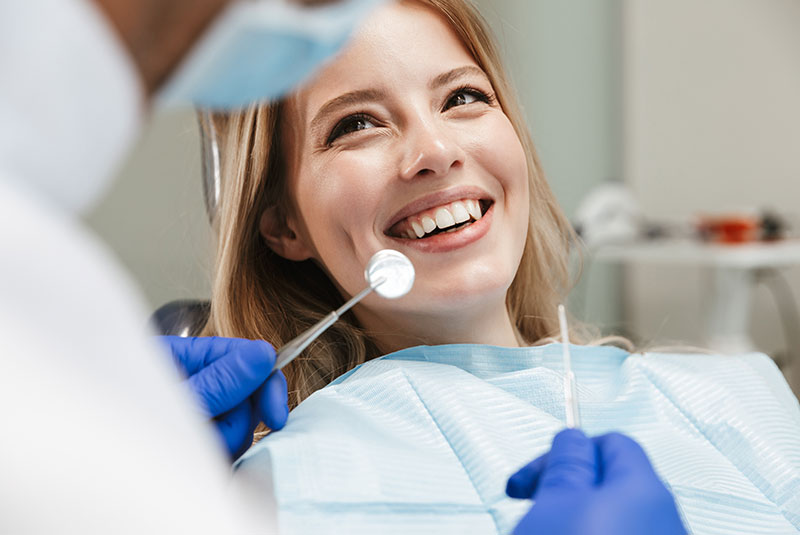 gum surgery patient smiling at dentist