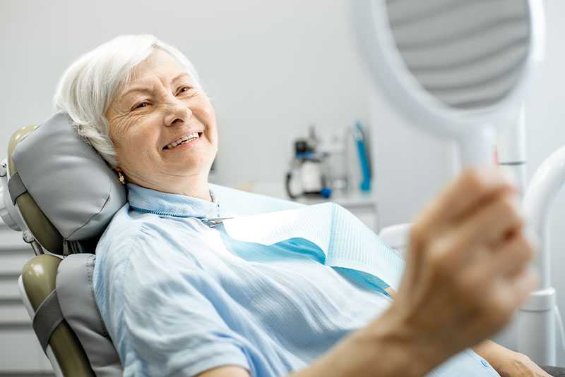 older dental patient smiling